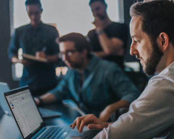 The Great Online team members working on laptops